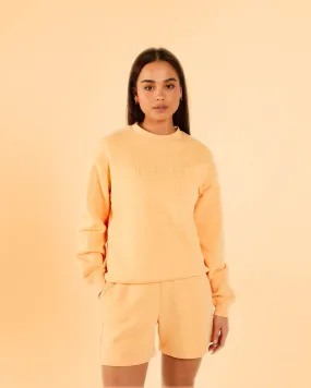 Dream Sweatshirt Summer Peach - Shop now for the perfect summer peach-colored sweatshirt