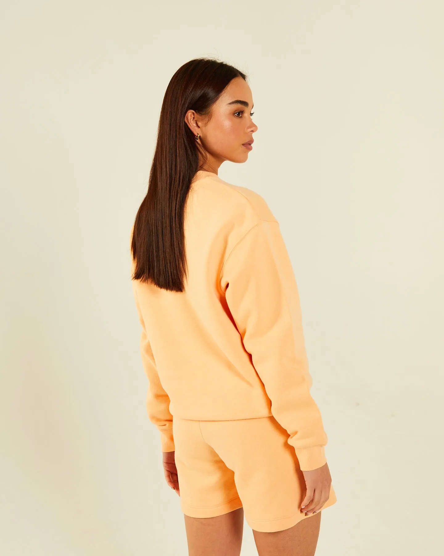 Dream Sweatshirt Summer Peach - Shop now for the perfect summer peach-colored sweatshirt