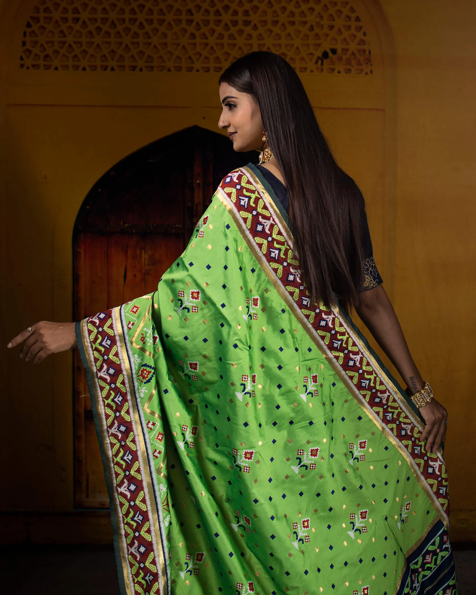 Parakeet Green And Navy Blue Patola Pattern Zari Jacquard Bordered Premium Banarasi Silk Saree With Blouse