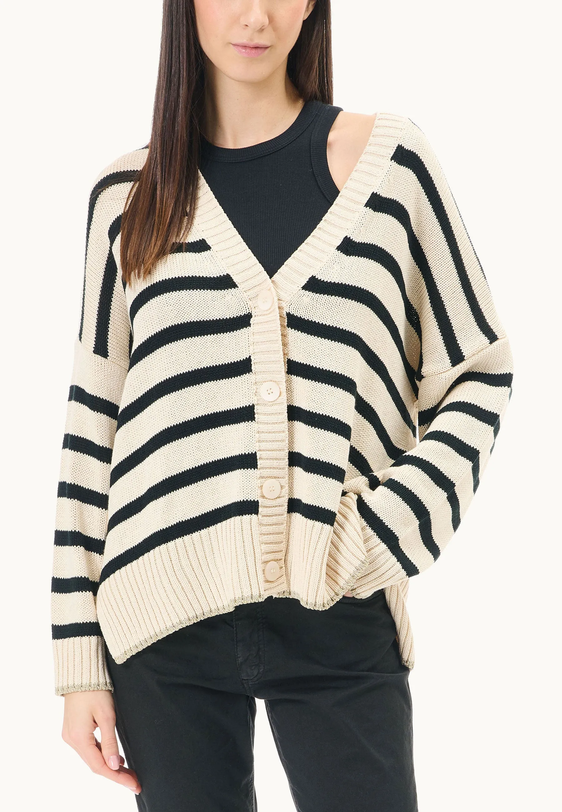 Sweater with lurex border over striped pattern.