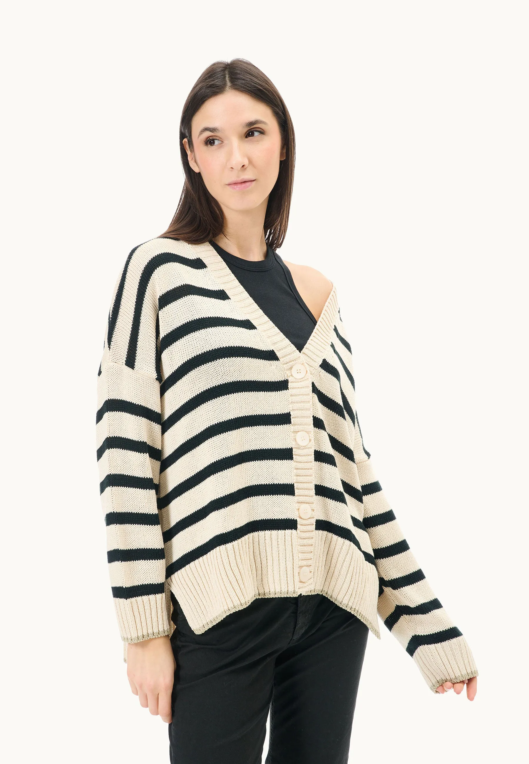 Sweater with lurex border over striped pattern.