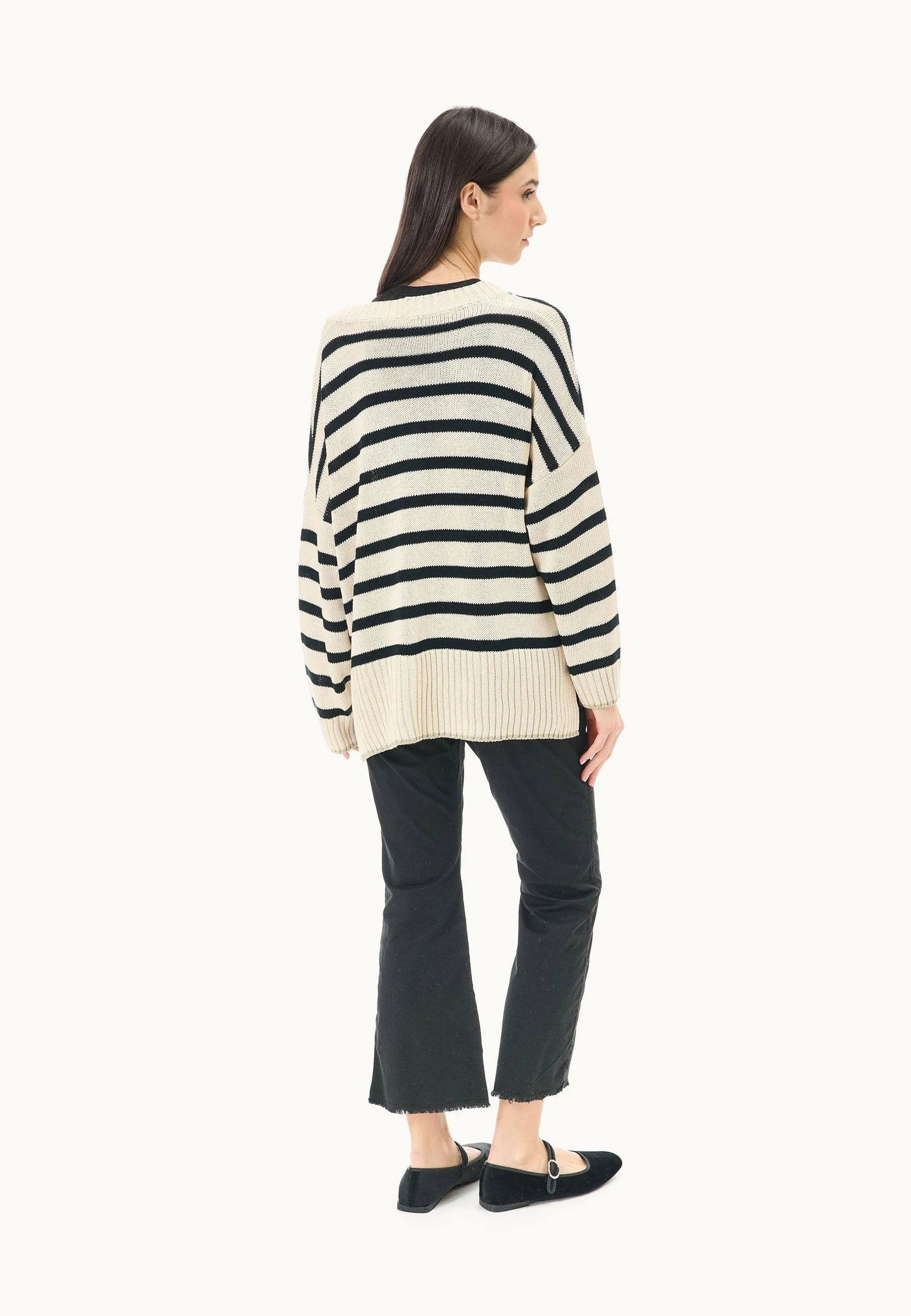 Sweater with lurex border over striped pattern.